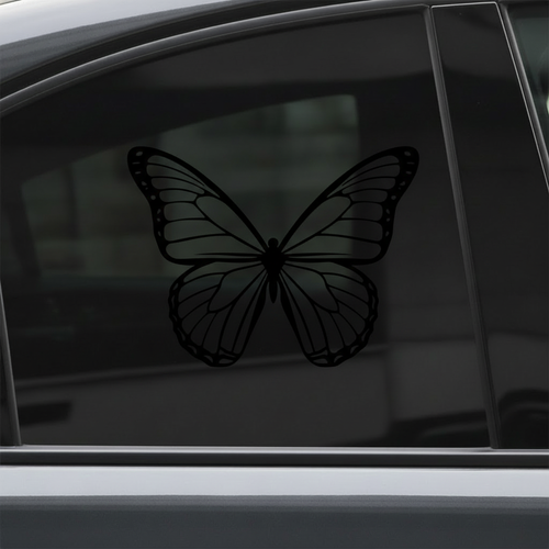 Black butterfly decal on car window